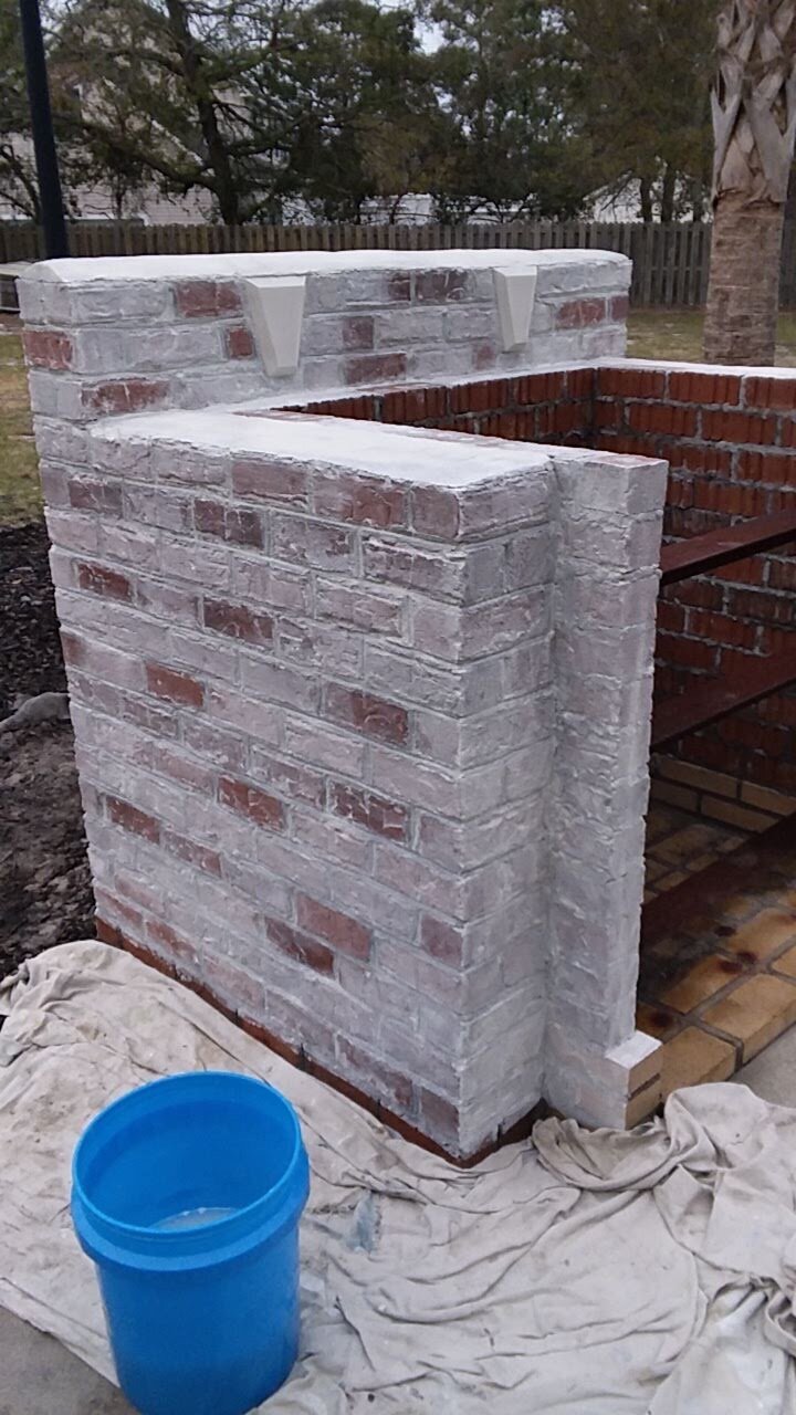 Chimney with fresh white lime-wash