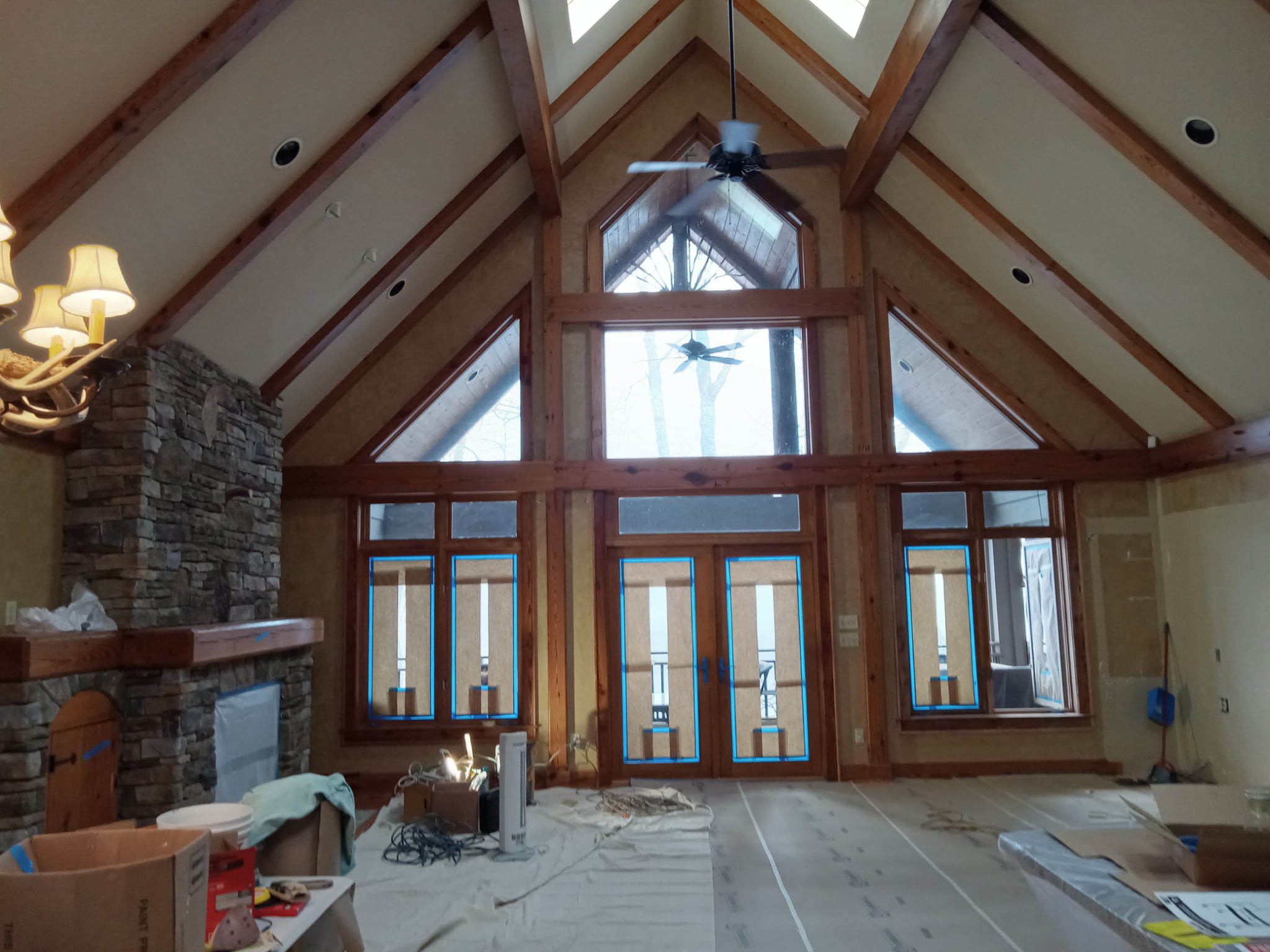 Cathedral great room with stone fireplace mid interior repaint