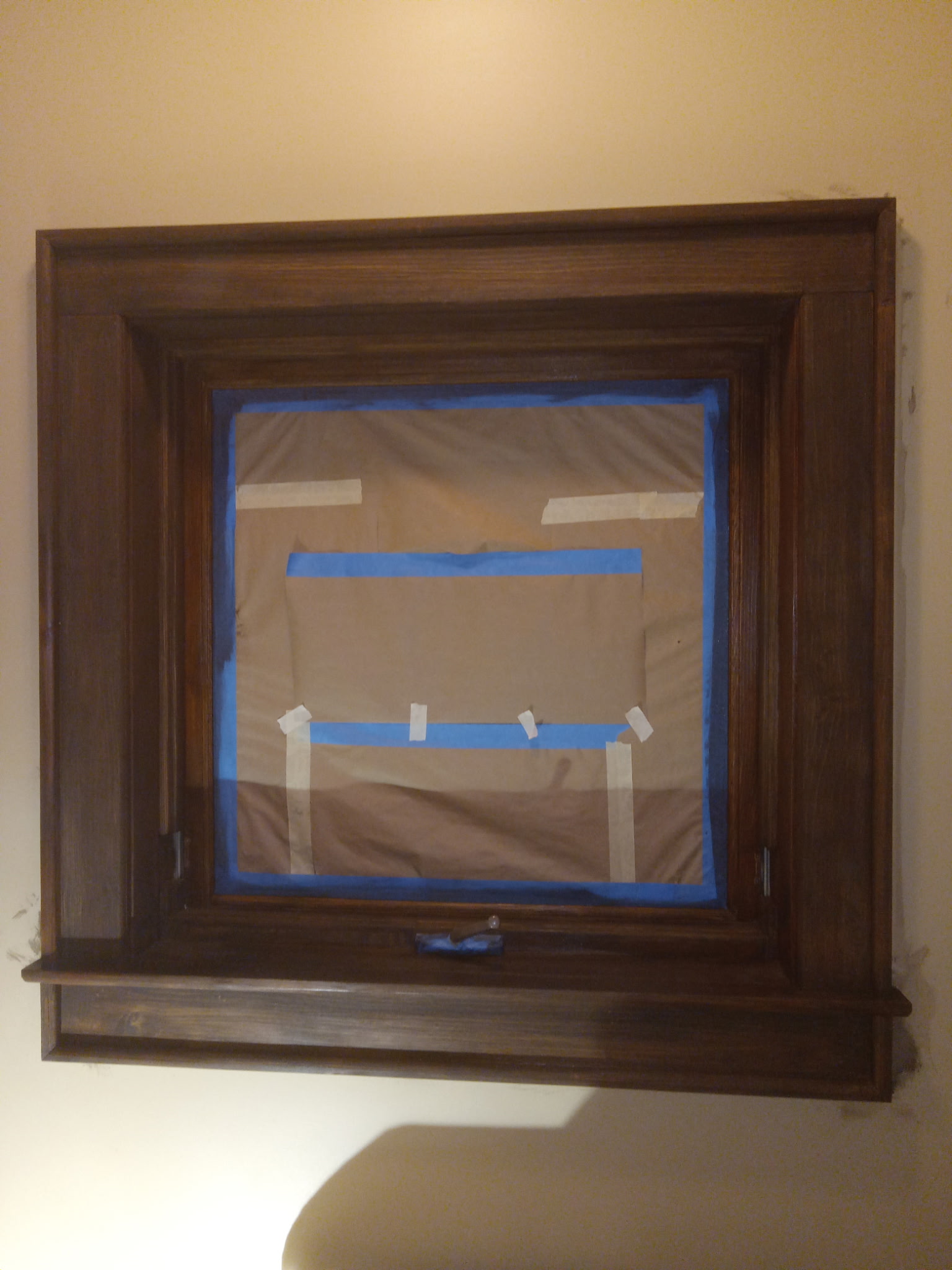 Walnut-stained interior window casing after restain by Flying Colors