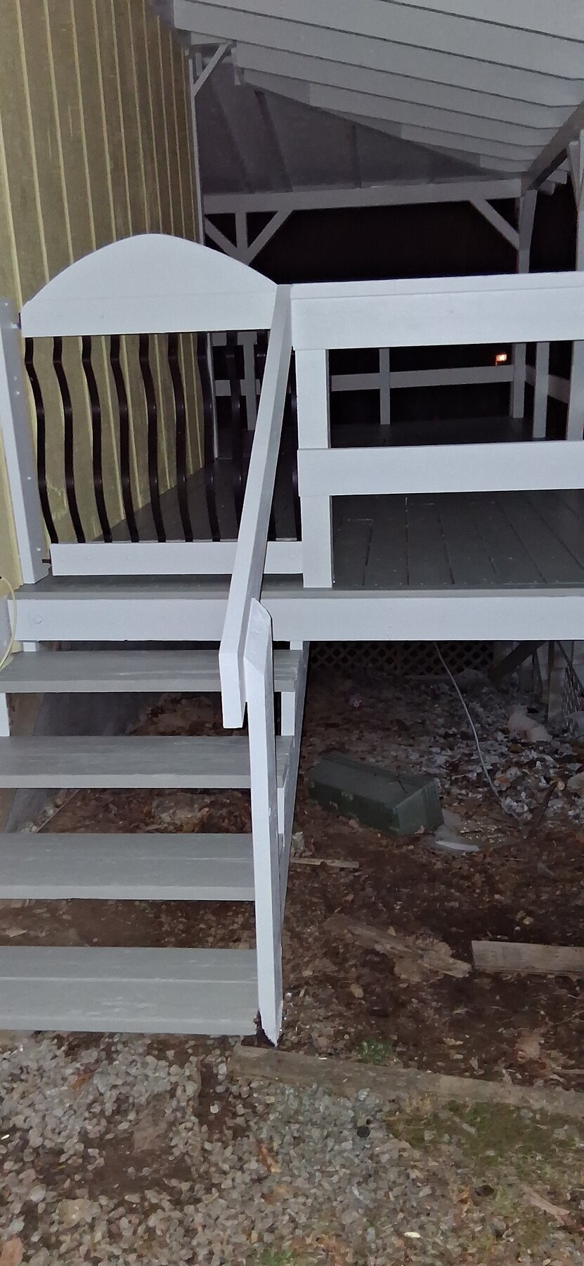 Freshly painted white staircase with crisp risers and treads